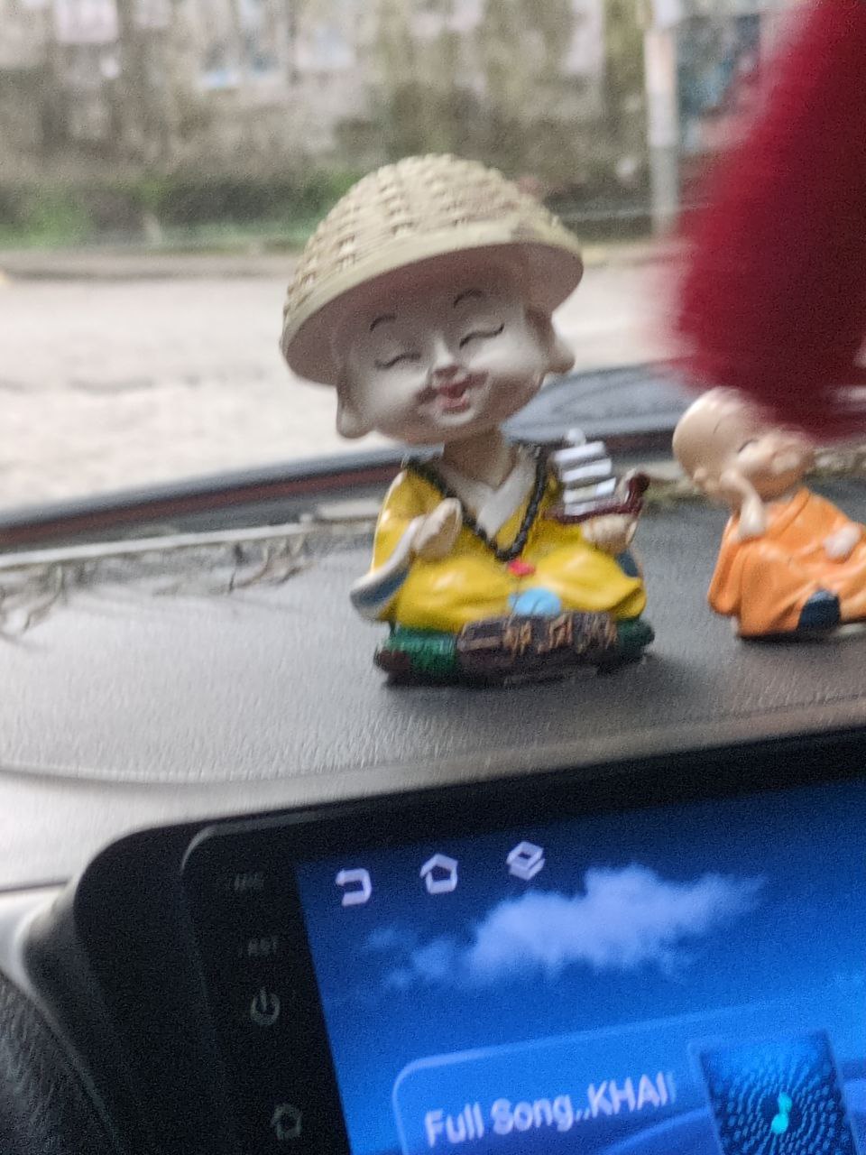 The trio pack, with a giant doll in middle in the Uber we took